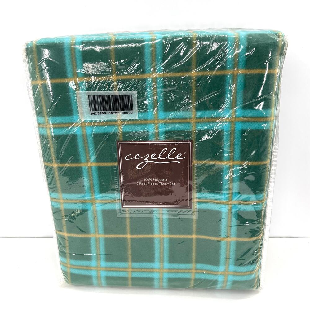 Cozelle two 50”x60” fleece throws. Plaid and solid color.